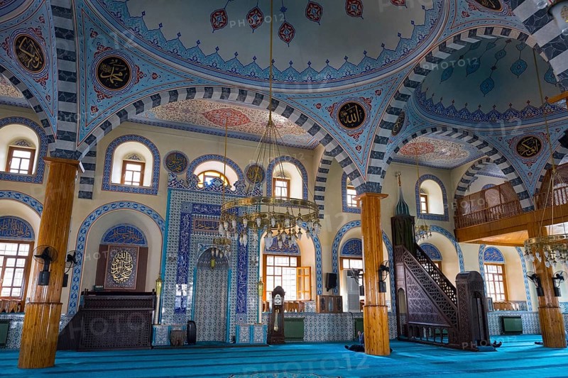 Bright mosque interior with ornate blue ornaments and majestic dome, Kapu Mosque, Ottoman era mosque, Konya, Central Anatolia, Turkey