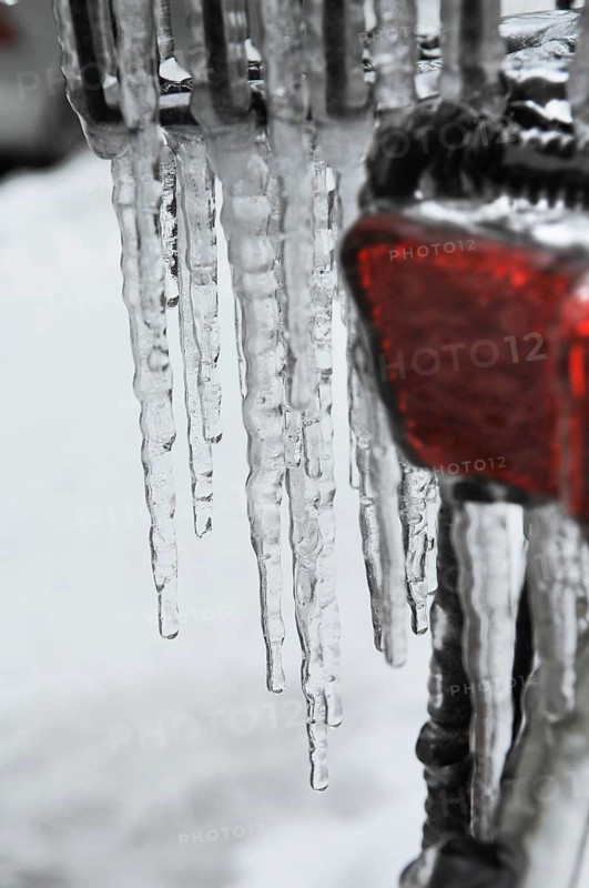 Bicycle icy due to freezing rain, icicles, detailed view