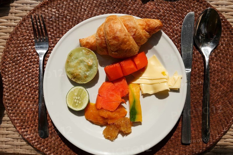 Rich breakfast at the hotel with fruits and vegetables, Ubud, Bali, Indonesia