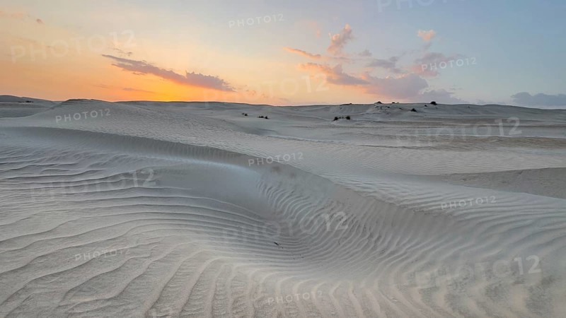 Sunset, white sand dunes in the Khaluf desert, Oman