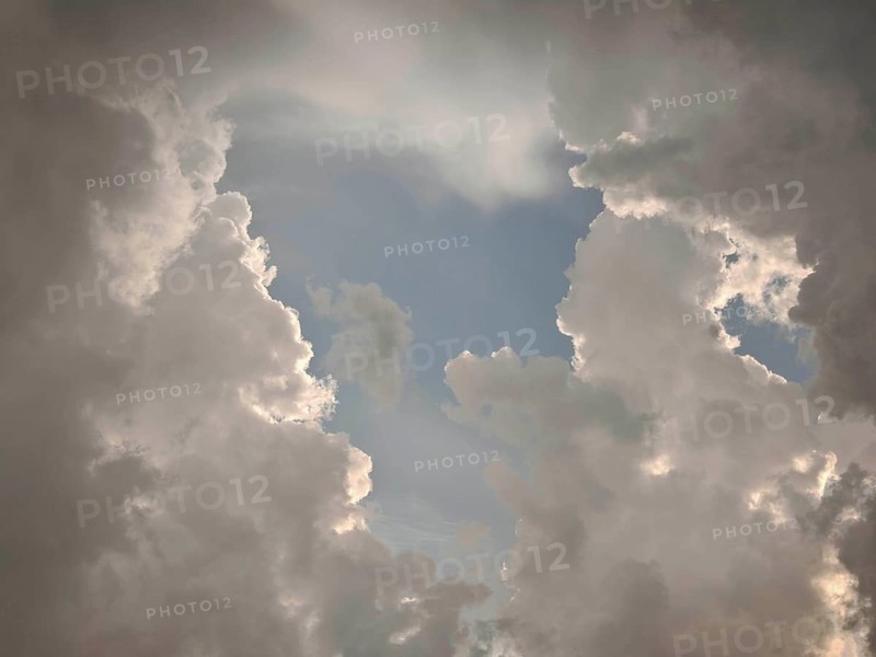 Dramatic cloud formations in the sky allow light to shine through, Germany