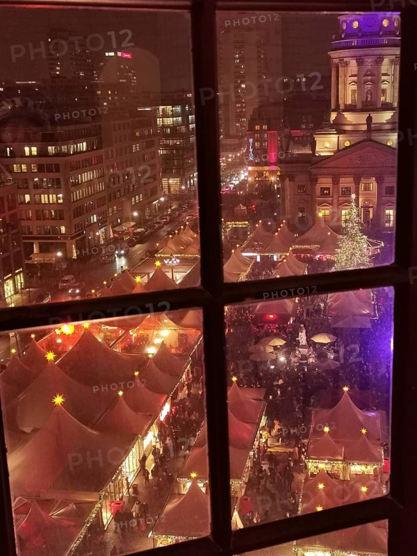View of an illuminated Christmas market in the city at night, Gendarmenmarkt, Berlin