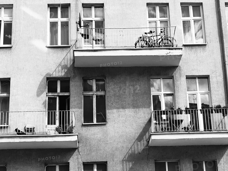 Multi-storey building with balconies and bicycles, urban atmosphere, Poland