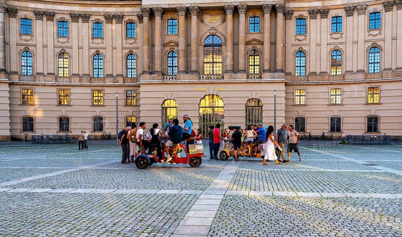 Tourist group with guides on Bebelplatz in Mitte, Berlin, Germany