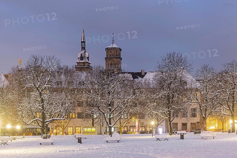 Winter in Stuttgart. The city is wintry white early in the morning. Castle square with collegiate church. Stuttgart, Baden-Württemberg, Germany