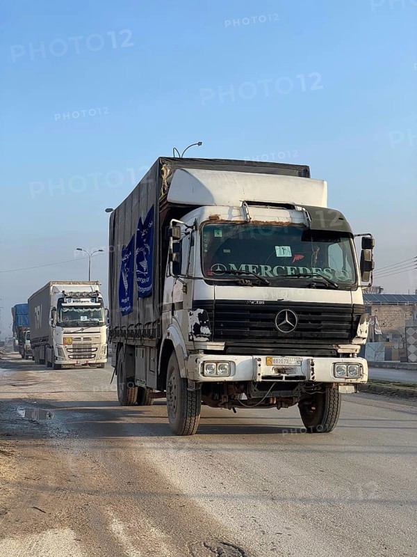 In Aleppo, Syria on January 25, 2026, a 24-vehicle humanitarian aid convoy, carrying UN relief items, departs for Ayn al-Arab. The mission follows a 15-day extension of the temporary ceasefire between the Syrian government and the YPG, Aleppo, Ayn al-Arab, Syria