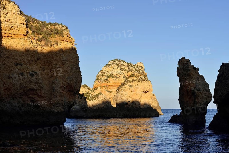 Rocky coast in evening light, Ponta da Piedade, Lagos, Algarve, Portugal