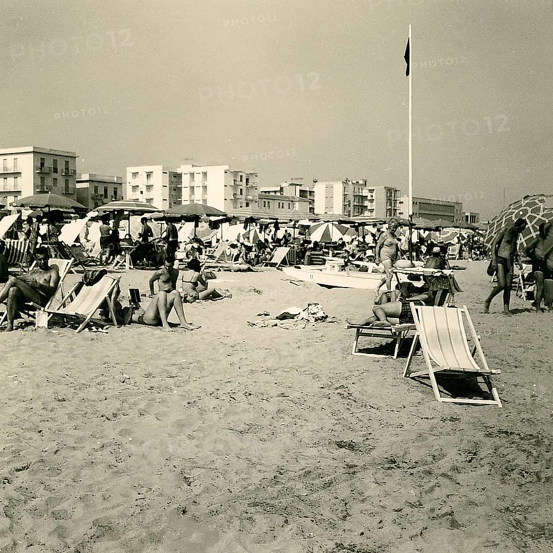 Historical photo summer 1961, tourists, beach, Rimini, Italy