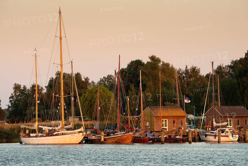 Sunset with boat on the lagoon near Gager on Rügen, Rügen, Gager, Mecklenburg-Western Pomerania, Germany