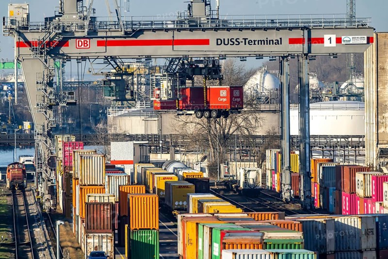 The port of Mannheim is one of the most important inland ports in Europe. The harbor basins stretch across the Rhine and Neckar. DUSS Terminal Deutsche Bahn AG with container from DB Cargo in the Mühlauhafen container terminal. Mannheim, Baden-Württemberg, Germany