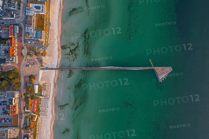 Aerial view over Seebrücke, pier and sandy beach at seaside resort Scharbeutz along the Baltic Sea, Ostholstein, Schleswig-Holstein, Germany