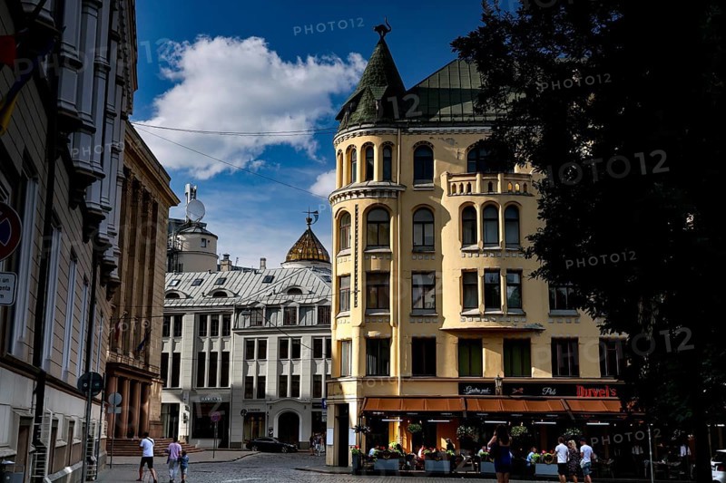 Historic buildings on Livu Square in Riga, including the Cat House, in sunny skies, Riga, Latvia