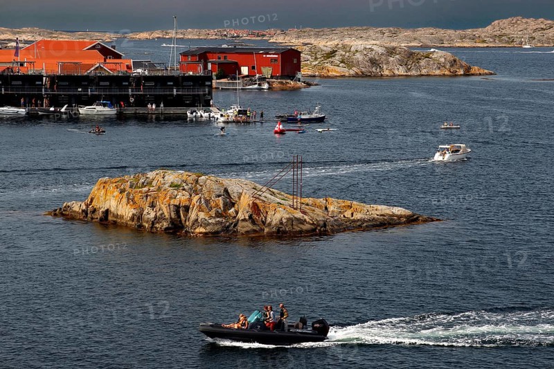 Busy water near Klädesholmen with boats and distinctive coastal cliffs, Klädesholmen, Sweden