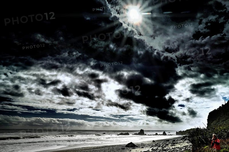 Dramatic beach with dark skies in Greymouth, New Zealand, Greymouth, West Coast, New Zealand