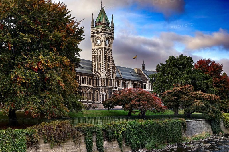 The University of Otago Clocktower building surrounded by autumn trees, Dunedin, Otago, New Zealand