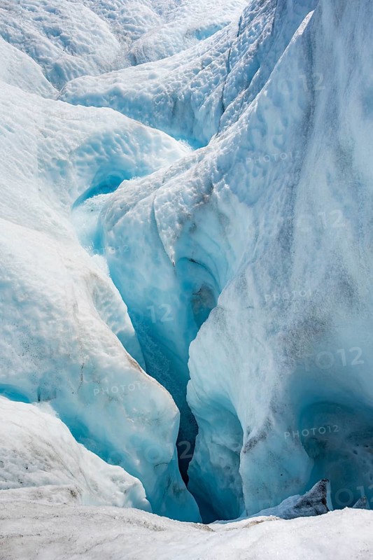 Waterfall in a crevasse on the ice of Root Glacier, Wrangell St. Elias National Park, Alaska, USA
