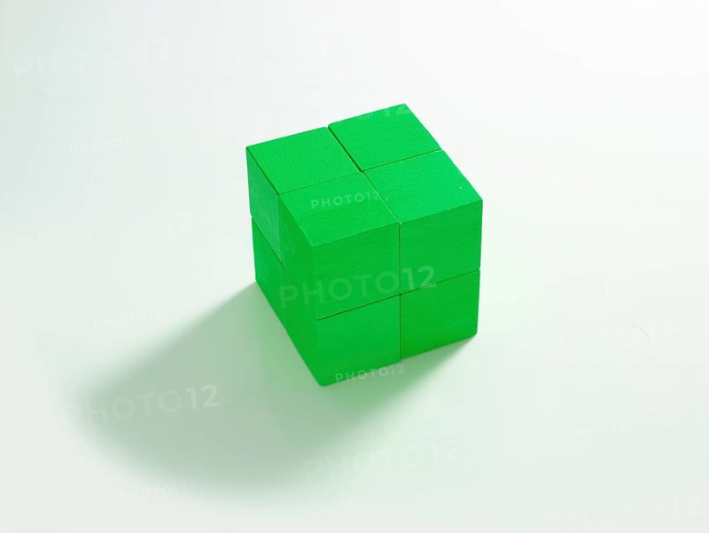 8 green wooden cubes against a white background