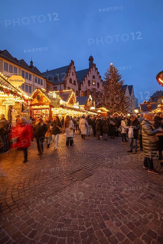 December 22, 2025, Frankfurt Christmas Market on Roemerberg at twilight. Traditional wooden stalls and festive lights shine in the historic square, Frankfurt, Hesse, Germany