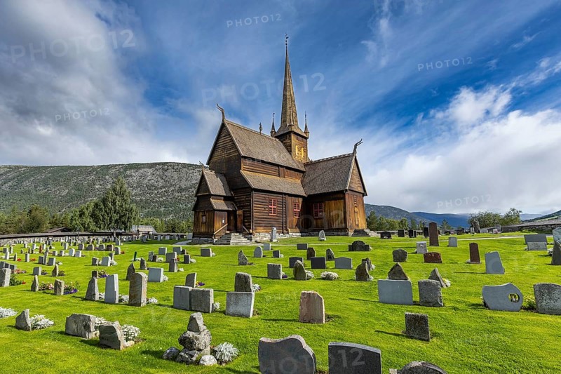 Lom Stave Church (Lom stavkyrkje) with cemetery in the foreground, Lom, Norway
