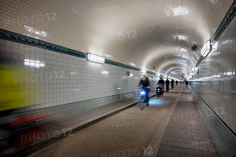Interior view, pedestrians and cyclists crossing tunnel, mopping effect, movement, tube, historic old Elbe Tunnel, Free and Hanseatic City of Hamburg, Germany