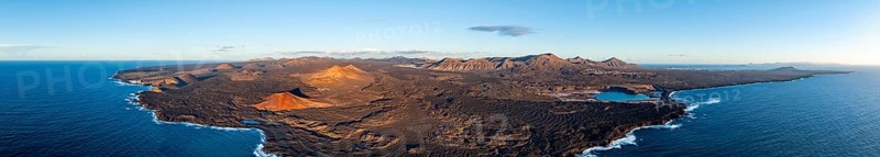 Coast with lava fields, volcanic landscape near Los Hervideros with red volcano Montaña Bermeja, in the evening light, aerial view, Lanzarote, Canary Islands, Spain