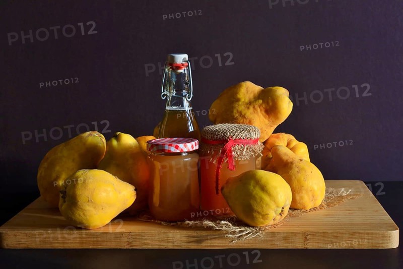 Still life with quinces, homemade quince jelly and quince liqueur, autumn, Germany