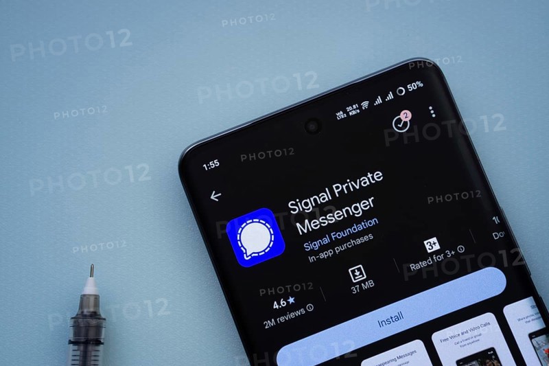 Dhaka, Bangladesh- 29 May 2025: On a blue surface, a smartphone displays the Signal app within the Google Play Store