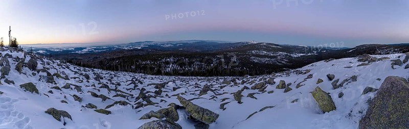 View from Mount Lusen over the hills of the bavarian forest at sunrise in winter, Bavaria, Germany
