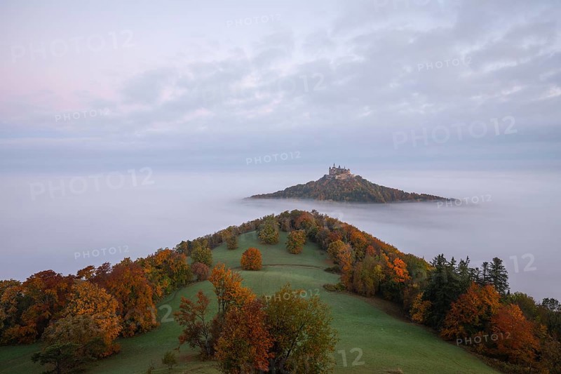 Hohenzollern Castle in a sea of fog at sunrise, autumn in the Swabian Jura