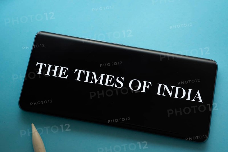 Dhaka, Bangladesh - 18 March 2025: The logo of the times of india is displayed on a smartphone screen