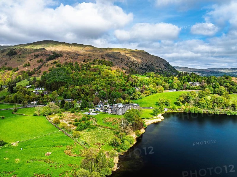 Farms and Mountains over road A591 from a drone, Grasmere Lake, Grasmere, Ambleside, Lake District, Westmorland, Cumbria, UK