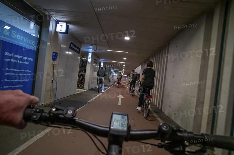 Ride your bike into and out of the bicycle car park at Utrecht Centraal station, Stationsplein, over 13, 000 parking spaces, considered the largest bicycle car park in the world, over 3 underground floors, Utrecht, Netherlands