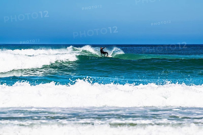 Surfer riding a wave on Contis beach, Saint Julien en Born, Saint-Julien-en-Born, Landes, France
