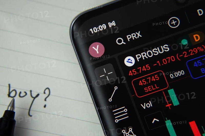 Dhaka, Bangladesh- 20 June 2025: Prosus stock trading details displayed on smartphone with handwritten note