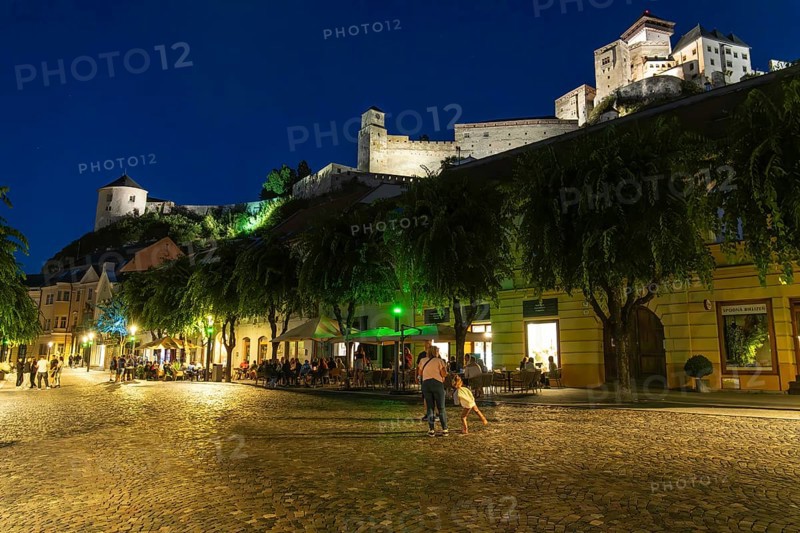 Night shot of the Peace Square in the historic centre of Trencín, Trencín Castle in the background, Capital of Culture 2026, Trencín, Slovakia