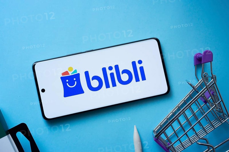 Dhaka, Bangladesh- 03 July 2025: Smartphone displaying Blibli logo with shopping cart on a blue background