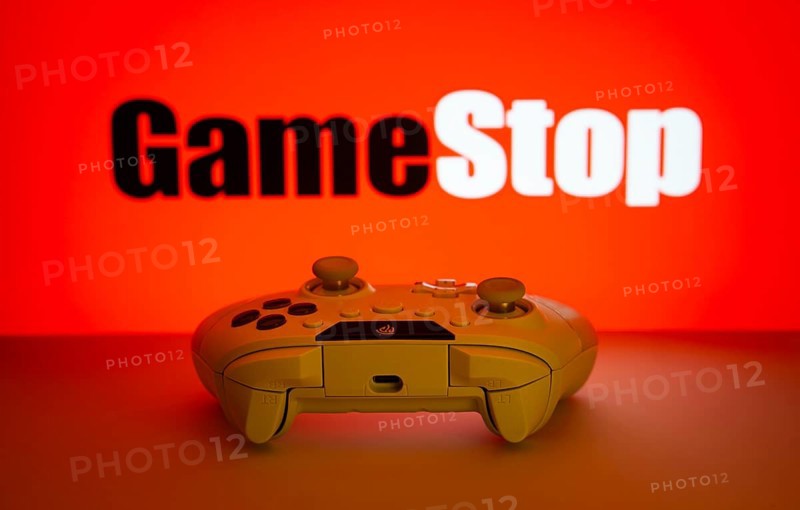 Dhaka, Bangladesh- 15 July 2025: Game controller in front of GameStop logo on a background