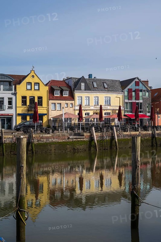 Building at the harbour, reflection, Husum, North Sea, North Frisia, Schleswig-Holstein, Germany