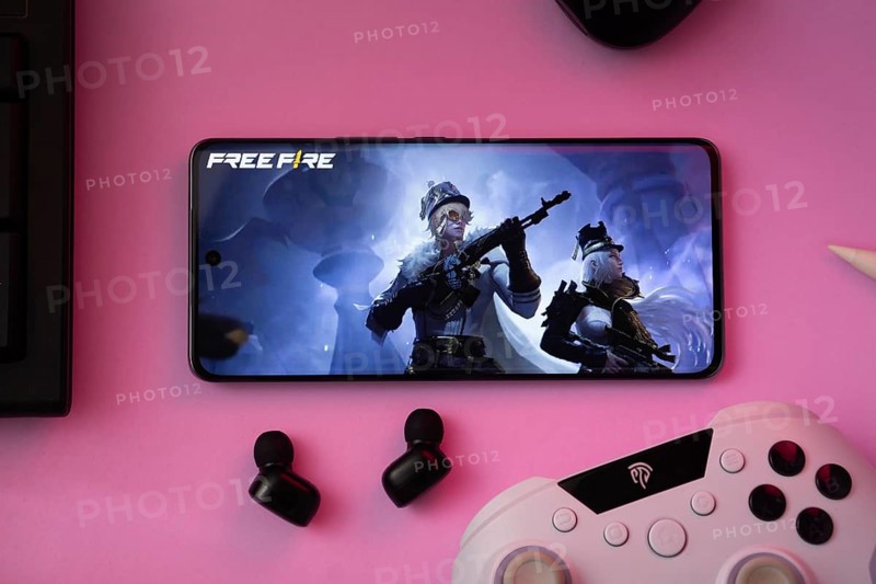 Dhaka, Bangladesh- 03 July 2025: A close-up of a gamepad with the Garena Free Fire seen on smartphone