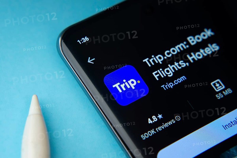 The trip.com app from Google Playstore is displayed on a smartphone screen