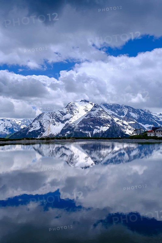Mountain lake with alpine panorama, snow pond Finkenberg, Penken, Mayrhofen, Zillertal, Tyrol, Austria