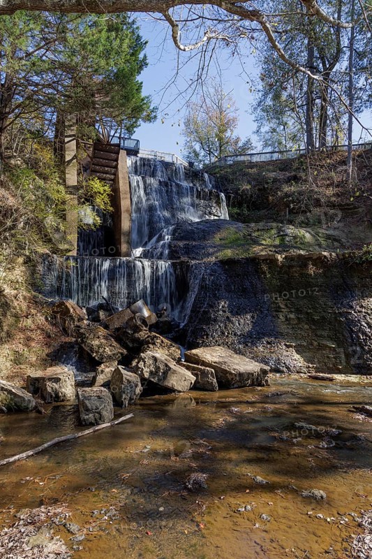 Water diverted from nearby Chunky River to this man-made waterfall to power a grist and cotton mill at Dunn's Falls Park near Enterprise, Mississippi, USA