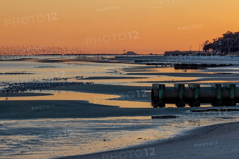 Sunset on the Mississippi Sound along the coastline of Long Beach, Mississippi, USA