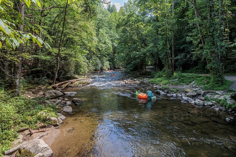 Visitors tubing down Deep Creek in the Smoky Mountains near Bryson City, North Carolina, USA
