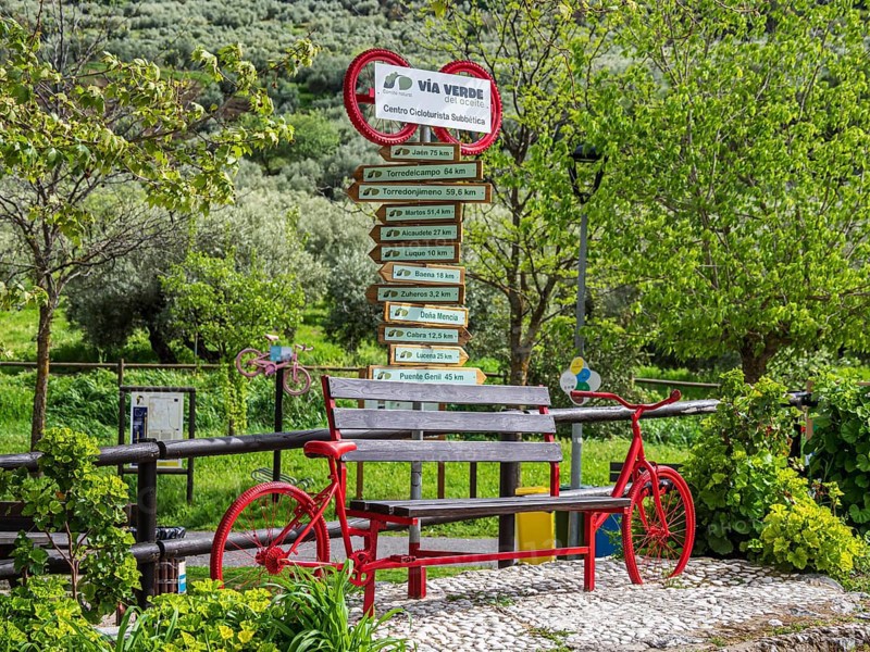 Decorated signpost, cycle path Via Verde Del Aceite, village Dona Menica, Andalusia, Spain