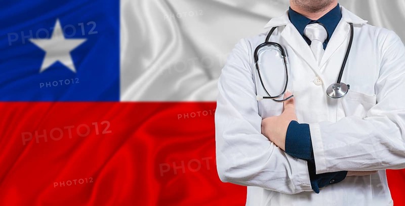 Male doctor with stethoscope on Chile flag. Doctor holding stethoscope on Chile flag