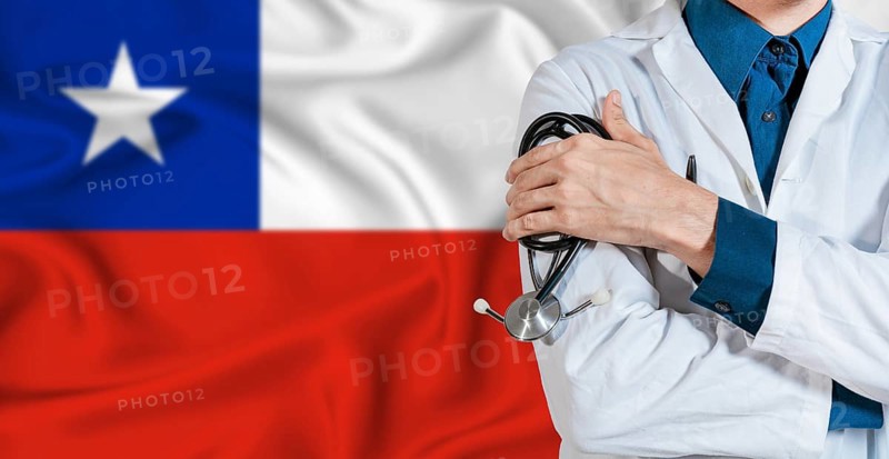Doctor with stethoscope on Chile flag. Doctor holding stethoscope on Chile flag