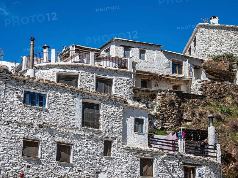 Whitewashed facade of a tradtional house, village Trevelez, one of the whitewashed villages on the slopes of the Sierra Nevada, Andalusia, Spain