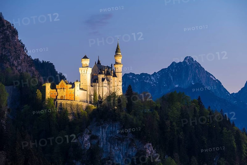 Fairytale castle in front of a tranquil and mysterious mountain landscape, Neuschwanstein, Schwangau near Füssen, Ostallgäu district, Swabia, Bavaria, Germany