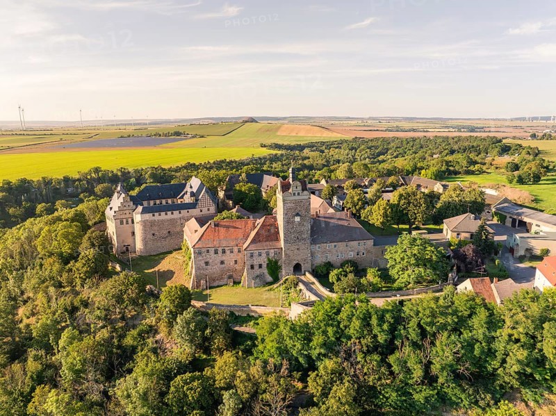 Aerial view of a historic medieval castle surrounded by green countryside, Allstedt, Harz, Germany